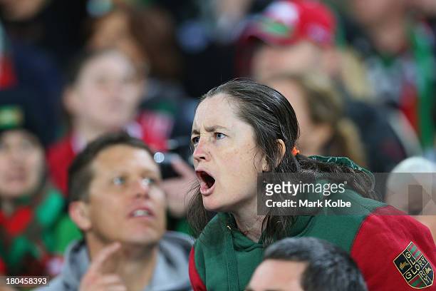 Rabbitohs supporter in the crowd shouts for her team during the NRL Qualifying match between the South Sydney Rabbitohs and the Melbourne Storm at...