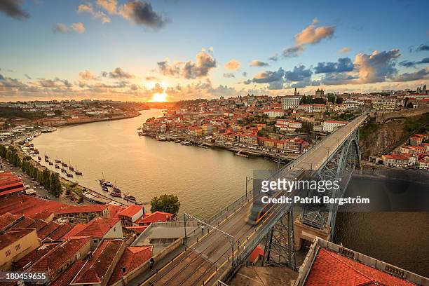 sunset over the beautiful city of porto - porto foto e immagini stock