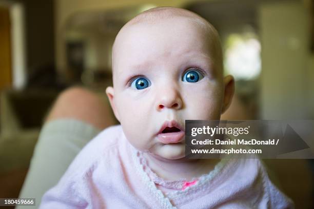 infant baby girl with amazed look on her face - selective focus imagens e fotografias de stock