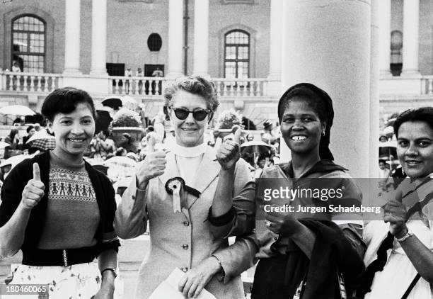 The leaders of the Federation of South African Women give the thumbs up after delivering a petition to the Union Buildings in Pretoria, South Africa,...