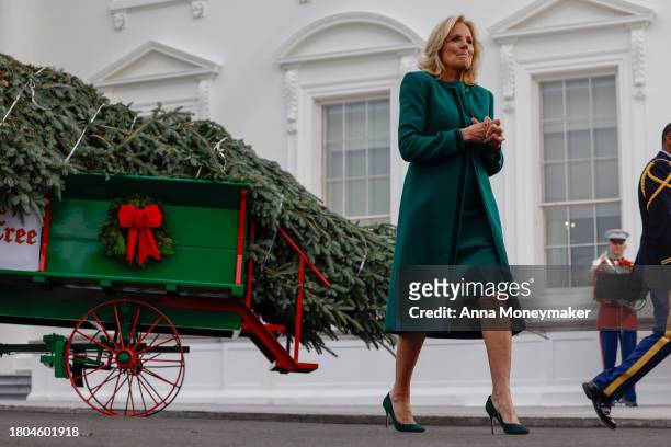 First lady Jill Biden speaks to reporters in front of the official 2023 White House Christmas Tree at the White House on November 20, 2023 in...