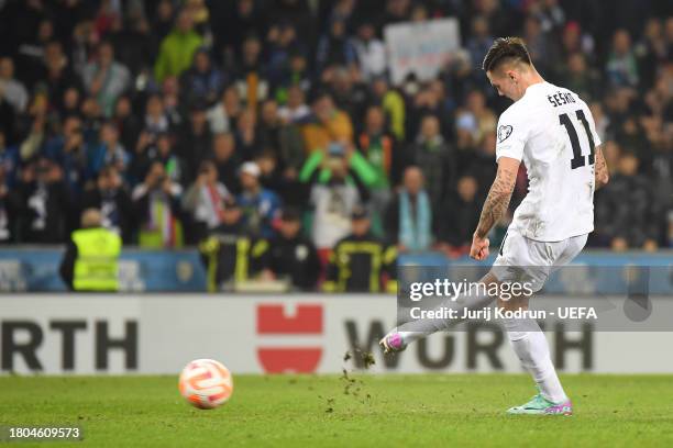 Benjamin Sesko of Slovenia scores the team's first goal from a penalty kick during the UEFA EURO 2024 European qualifier match between Slovenia and...