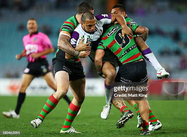 Will Chambers of the Storm is tackled during the NRL Qualifying match between the South Sydney Rabbitohs and the Melbourne Storm at ANZ Stadium on...