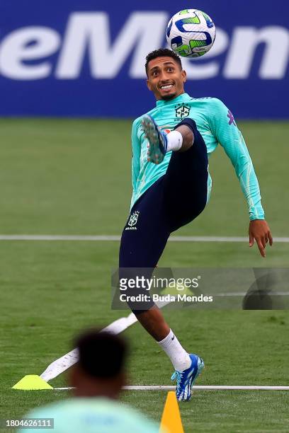Raphinha kicks the ball during a training session of the Brazilian national football team at the squad's Granja Comary training complex on Novermber...