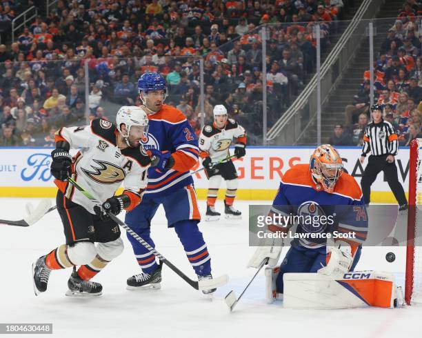 Adam Henrique of the Anaheim Ducks deflects the puck off the post against Stuart Skinner and Evan Bouchard of the Edmonton Oilers in the first period...