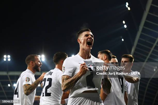 Benjamin Sesko of Slovenia celebrates after scoring the team's first goal during the UEFA EURO 2024 European qualifier match between Slovenia and...