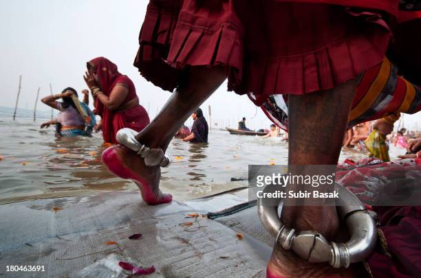 Pilgrims take bath at the bank of Sangam confluence of river Ganga, Yamnuna and mythical Saraswati at Kumbh mela in Allahabad, Uttar Pradesh,India on...