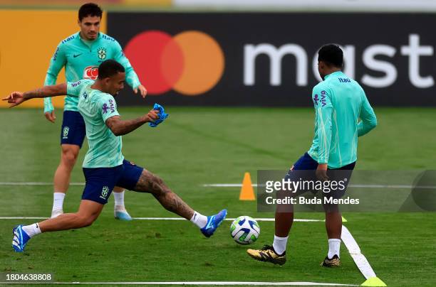 Gabriel Jesus fights for the ball with Endrick during a training session of the Brazilian national football team at the squad's Granja Comary...