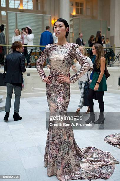 Model poses for photographs during the Kilian Kerner presentation at London Fashion Week SS14 at The Waldorf Hilton Hotel on September 13, 2013 in...