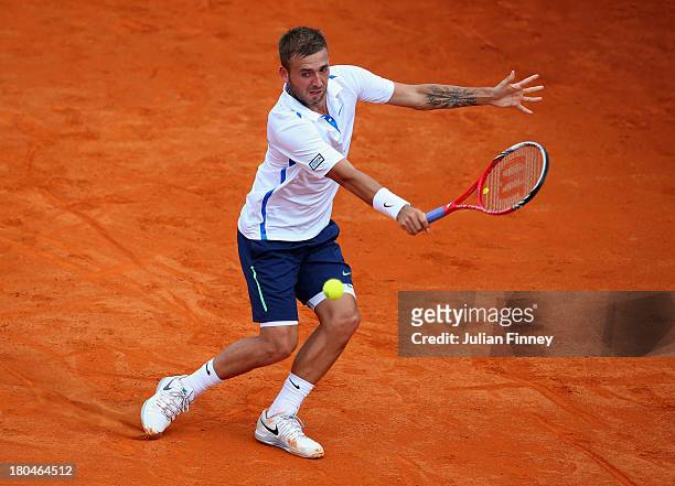 Daniel Evans of Great Britain in action against Ivan Dodig of Croatia during day one of the Davis Cup World Group play-off tie between Croatia and...