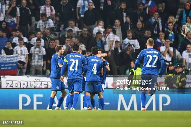 Ramazan Orazov of Kazakhstan celebrates with teammates after scoring the team's first goal during the UEFA EURO 2024 European qualifier match between...