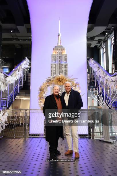 David Frei and John O'Hurley light the Empire State Building in honor of the National Dog Show at The Empire State Building on November 20, 2023 in...