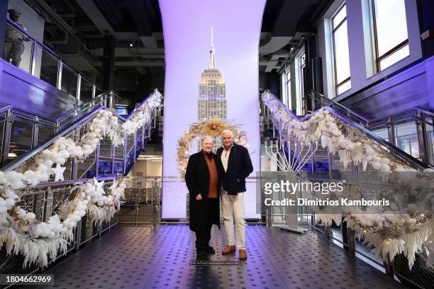 David Frei and John O'Hurley light the Empire State Building in honor of the National Dog Show at The Empire State Building on November 20, 2023 in...