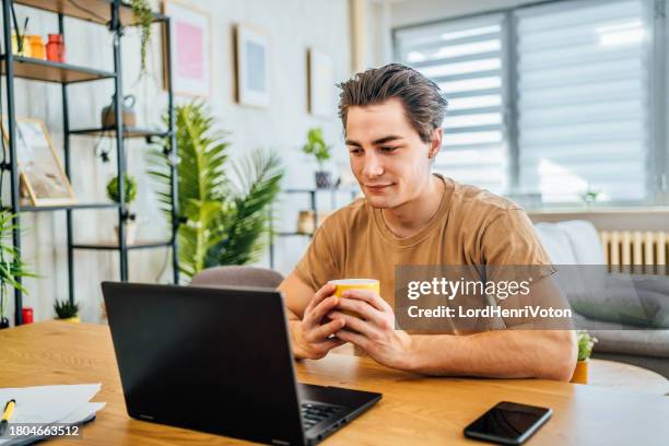 male student attending online class - attending webinar stock pictures, royalty-free photos & images