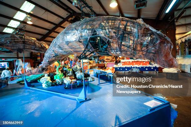 Dolphin made of recycled material is show as crews put the finishing touches on floats for the 74th Annual H-E-B Thanksgiving Day Parade on Monday,...