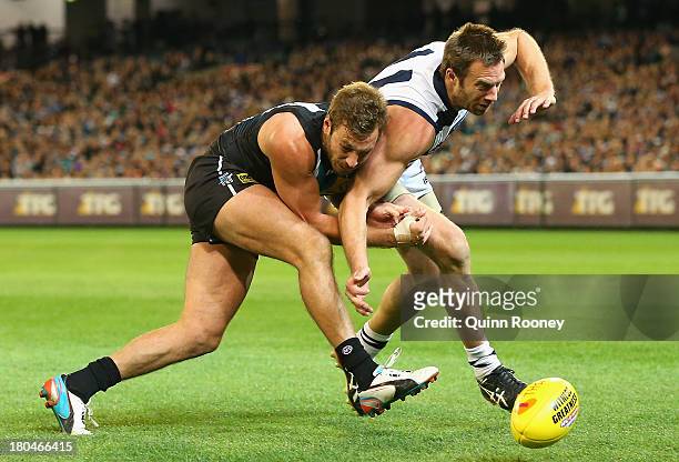 Tom Logan of the Power and Joel Corey of the Cats contest for the ball during the Second Semi Final match between the Geelong Cats and the Port...