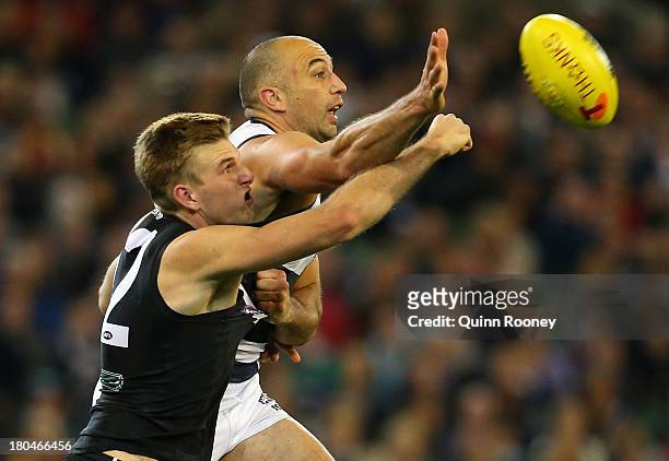 Jackson Trengove of the Power spoils a mark by James Podsiadly of the Cats during the Second Semi Final match between the Geelong Cats and the Port...