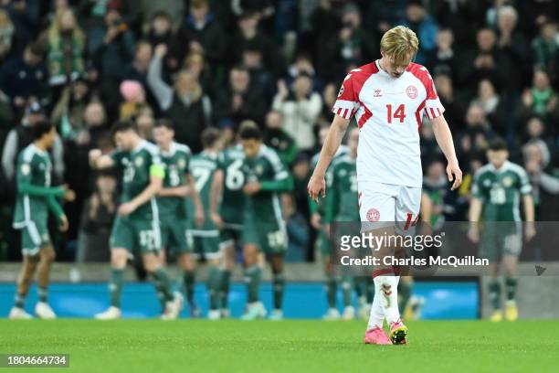 Victor Kristiansen of Denmark looks dejected after Dion Charles of Northern Ireland scores his team's second goal during the UEFA EURO 2024 European...