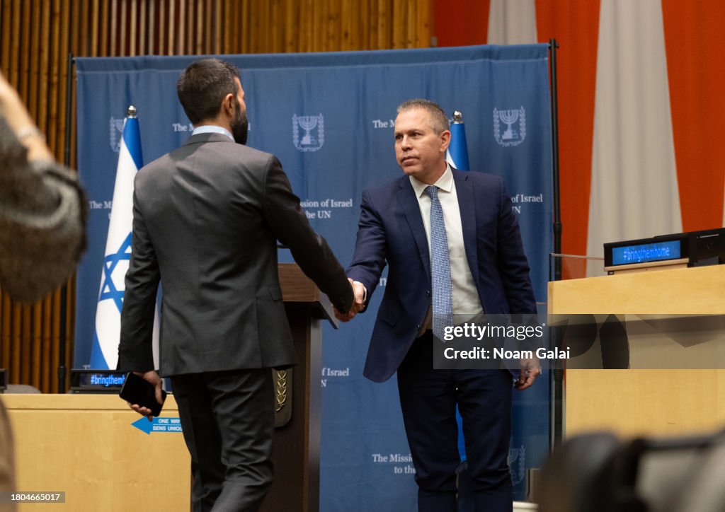 Mosab Mosab Hassan Yousef and Israeli UN Ambassador Gilad Erdan attend a ...
