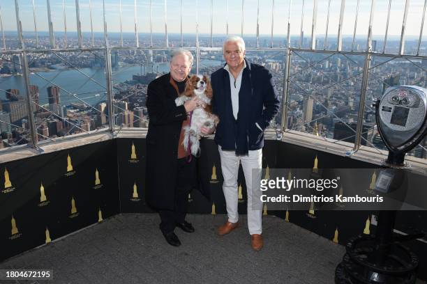 David Frei, holding "TruDat" and John O'Hurley pose as they light the Empire State Building in honor of the National Dog Show at The Empire State...