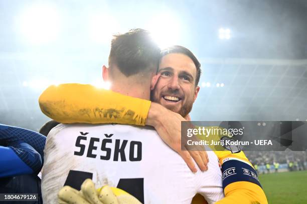Benjamin Sesko and Jan Oblak of Slovenia celebrate after the team's victory in the UEFA EURO 2024 European qualifier match between Slovenia and...