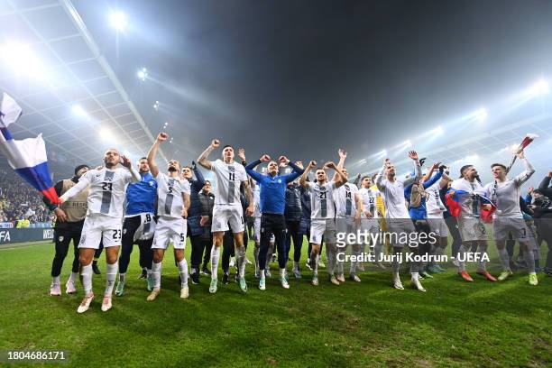 Players and staff of Slovenia celebrate after the team's victory in the UEFA EURO 2024 European qualifier match between Slovenia and Kazakhstan at...