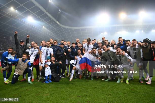 Players and staff of Slovenia celebrate after the team's victory in the UEFA EURO 2024 European qualifier match between Slovenia and Kazakhstan at...