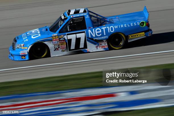 German Quiroga, driver of the NET10 Wireless Toyota, practices for the NASCAR Camping World Truck Series enjoyillinois.com 225 at Chicagoland...