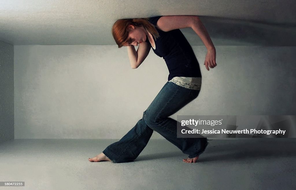 Girl trapped in narrow white space