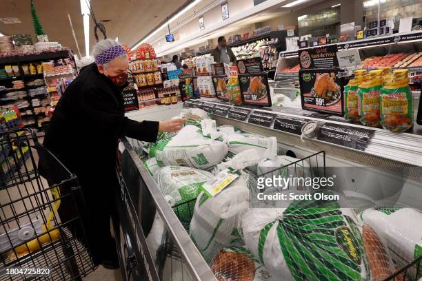 Customer looks for turkeys offered for sale ahead of the Thanksgiving Holiday on November 20, 2023 in Chicago, Illinois. The average cost of this...