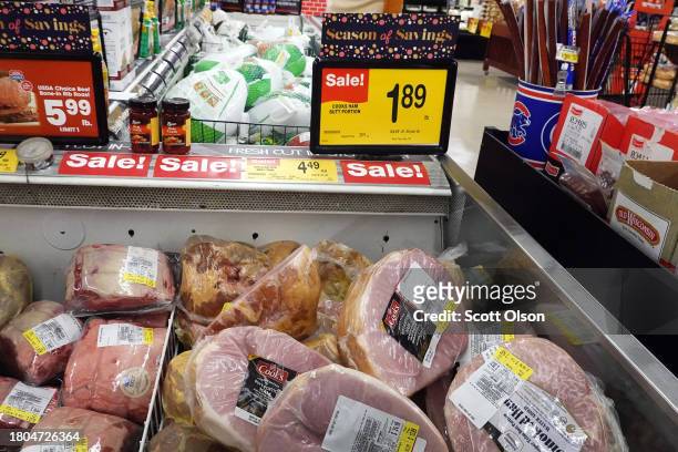 Hams are offered for sale at a grocery store ahead of the Thanksgiving Holiday on November 20, 2023 in Chicago, Illinois. The average cost of this...