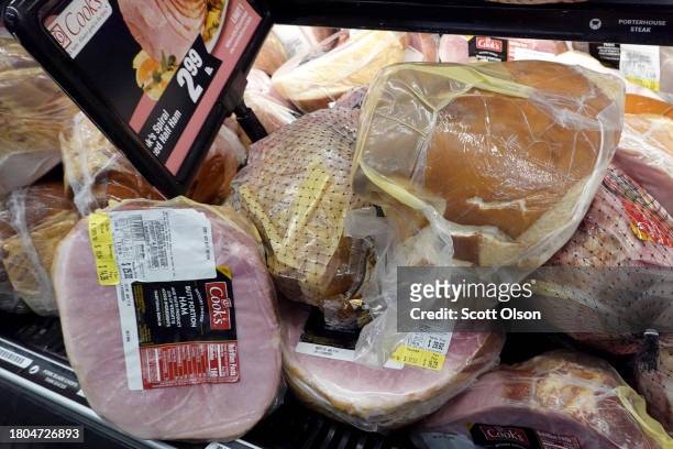 Hams are offered for sale at a grocery store ahead of the Thanksgiving Holiday on November 20, 2023 in Chicago, Illinois. The average cost of this...