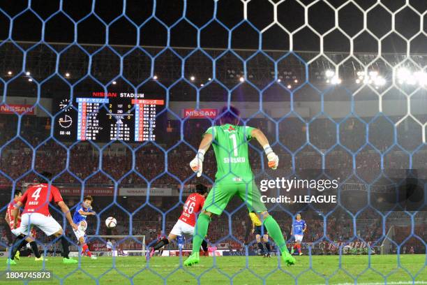 Manabu Saito of Yokohama F.Marinos scores his team's third goal past Shusaku Nishikawa of Urawa Red Diamonds during the J.League J1 second stage...