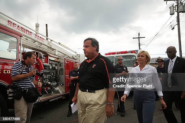 New Jersey Gov. Chris Christie walks away after speaking to the media at the scene of a massive fire that destroyed dozens of businesses along an...