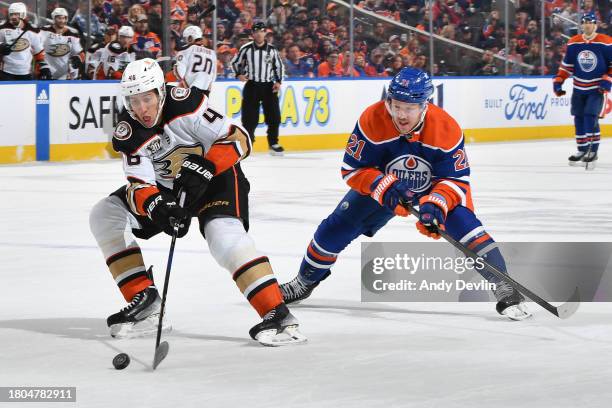 Ilya Lyubushkin of the Anaheim Ducks skates against Adam Erne of the Edmonton Oilers during the game at Rogers Place on November 26 in Edmonton,...