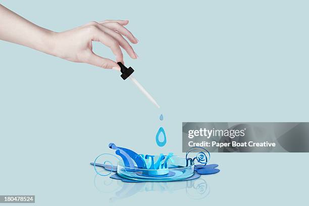 paper craft water droplet inside a petri dish - pipette stock pictures, royalty-free photos & images