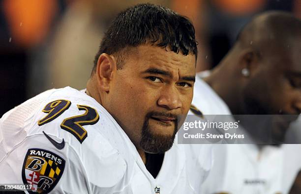 Haloti Ngata of the Baltimore Ravens looks on from the bench during the first quarter of the game against the Denver Broncos at Sports Authority...