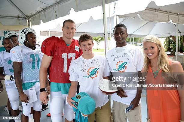 Ryan and Lauren Tannehill host students from American Senior High School at Dolphins training camp on August 15, 2013 in Davie, Florida.