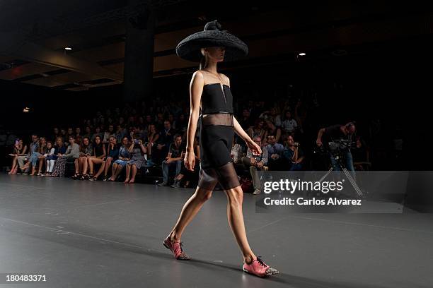 Model showcases designs by Victorio & Lucchino on the runway at Victorio & Lucchino show during Mercedes Benz Fashion Week Madrid Spring/Summer 2014...