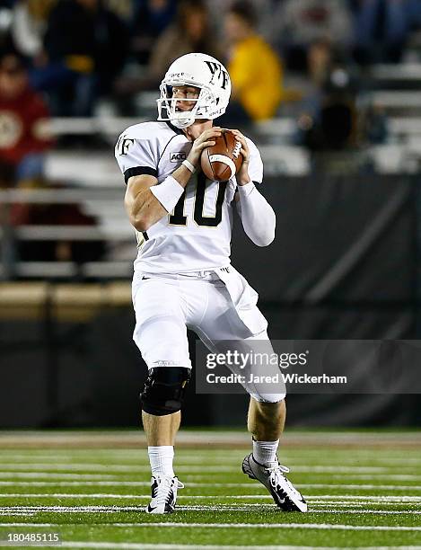 Tanner Price of the Wake Forest Demon Deacons plays against the Boston College Eagles during the game on September 6, 2013 at Alumni Stadium in...