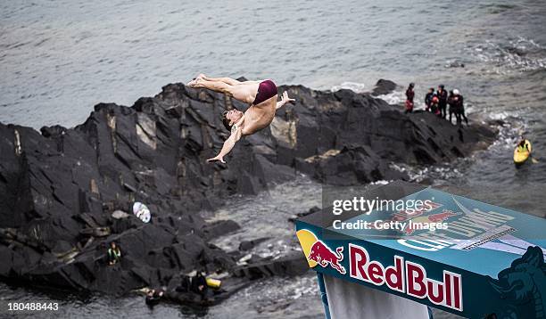 Mat Cowen of the UK dives from the 27 metre platform at the Blue Lagoon during the first round of the sixth stop of the Red Bull Cliff Diving World...