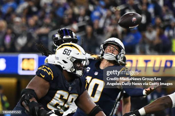 Inglewood, CA Chargers QB Justin Herbert, #10, tries to catch his deflected pass but it was recovered by the Ravens during 4th quarter action at SoFi...