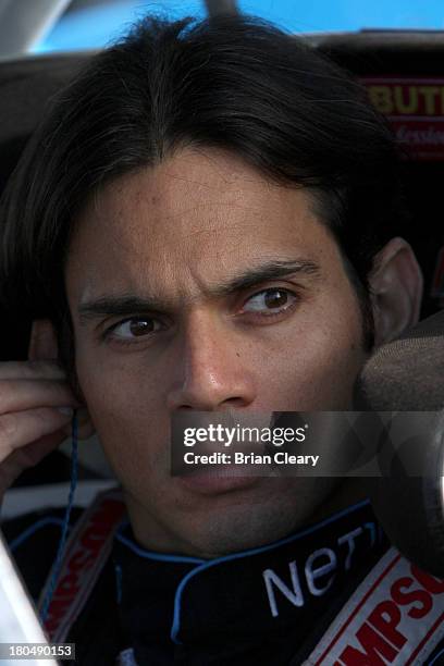 German Quiroga, driver of the NET10 Wireless Toyota, sits in his truck during practice for the NASCAR Camping World Truck Series enjoyillinois.com...