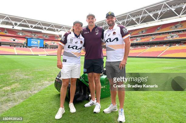 Cameron Smith, Brisbane Broncos NRL player Corey Oates, and Marc Leishman, pose for a photo before competing in a mowing challenge ahead of the 2023...