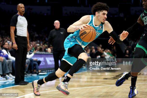 LaMelo Ball of the Charlotte Hornets dribbles the ball to the basket during the first half of an NBA game against the Boston Celtics at Spectrum...