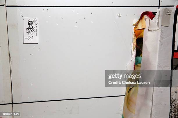 Skeches by designer Bibhu Mohapatra and fabric swatches pinned to his studio wall on September 5 one week prior to his runway show at Mercedes-Benz...