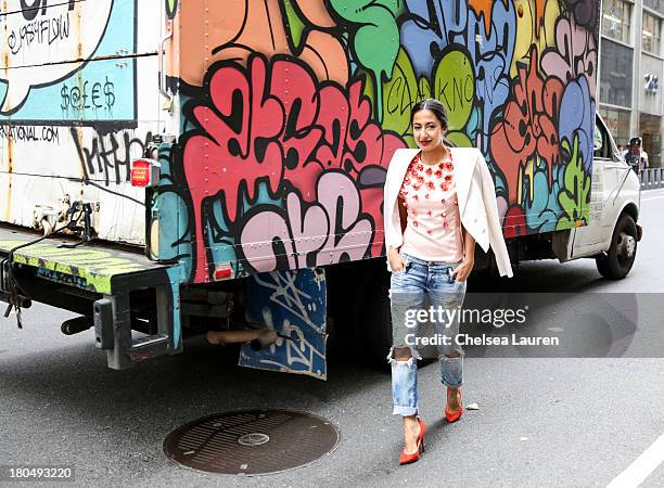 Nausheen Shah, writer and stylist working with MarieClaire.com and the New York Post, wears a Bibhu Mohapatra Spring 2014 coral baby tulip tulle top,...