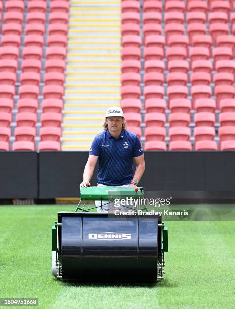 Cameron Smith competes in a mowing challenge against fellow Australian golfer Marc Leishman ahead of the 2023 Australian PGA Championship at Suncorp...