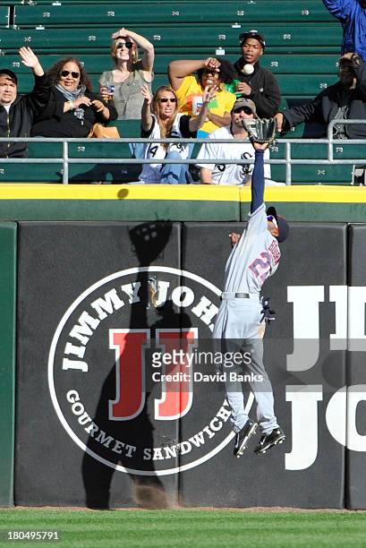 Michael Bourn of the Cleveland Indians makes a leaping catch on Jordan Danks of the Chicago White Sox during the ninth inning on September 13, 2013...