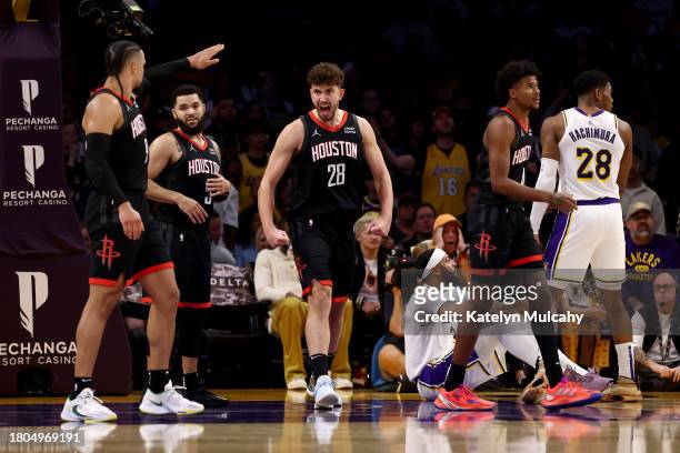 Alperen Sengun of the Houston Rockets reacts after an offensive charge call against Anthony Davis of the Los Angeles Lakers during the fourth quarter...